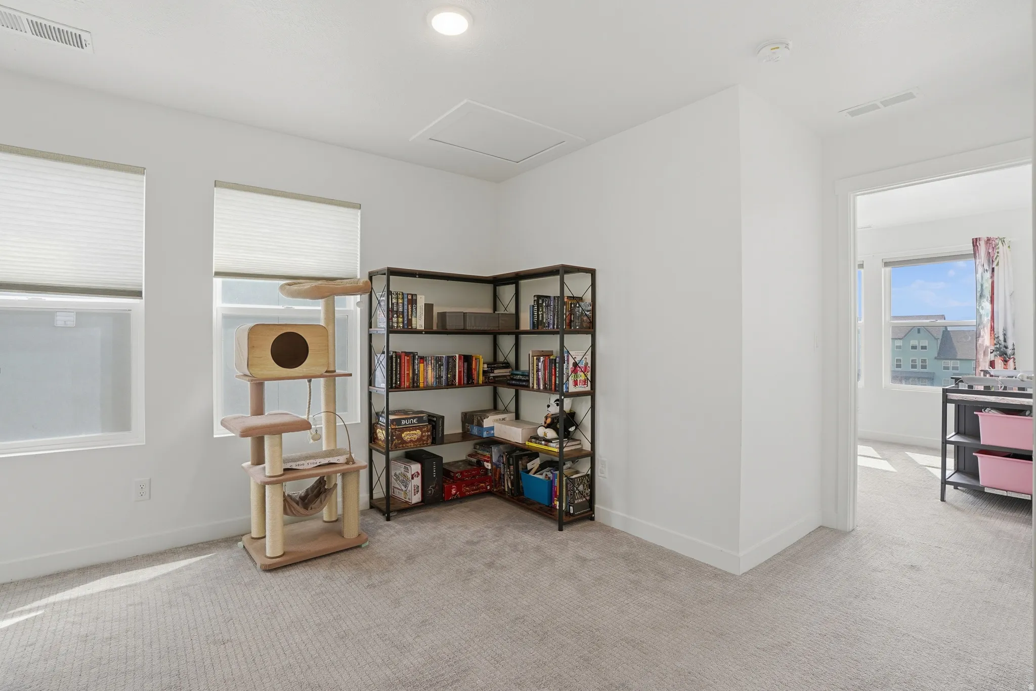 Misc room featuring light colored carpet