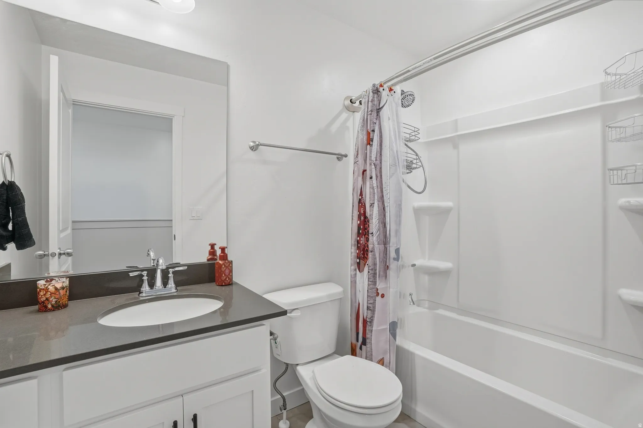 Full bath featuring vanity and shower / bath combo