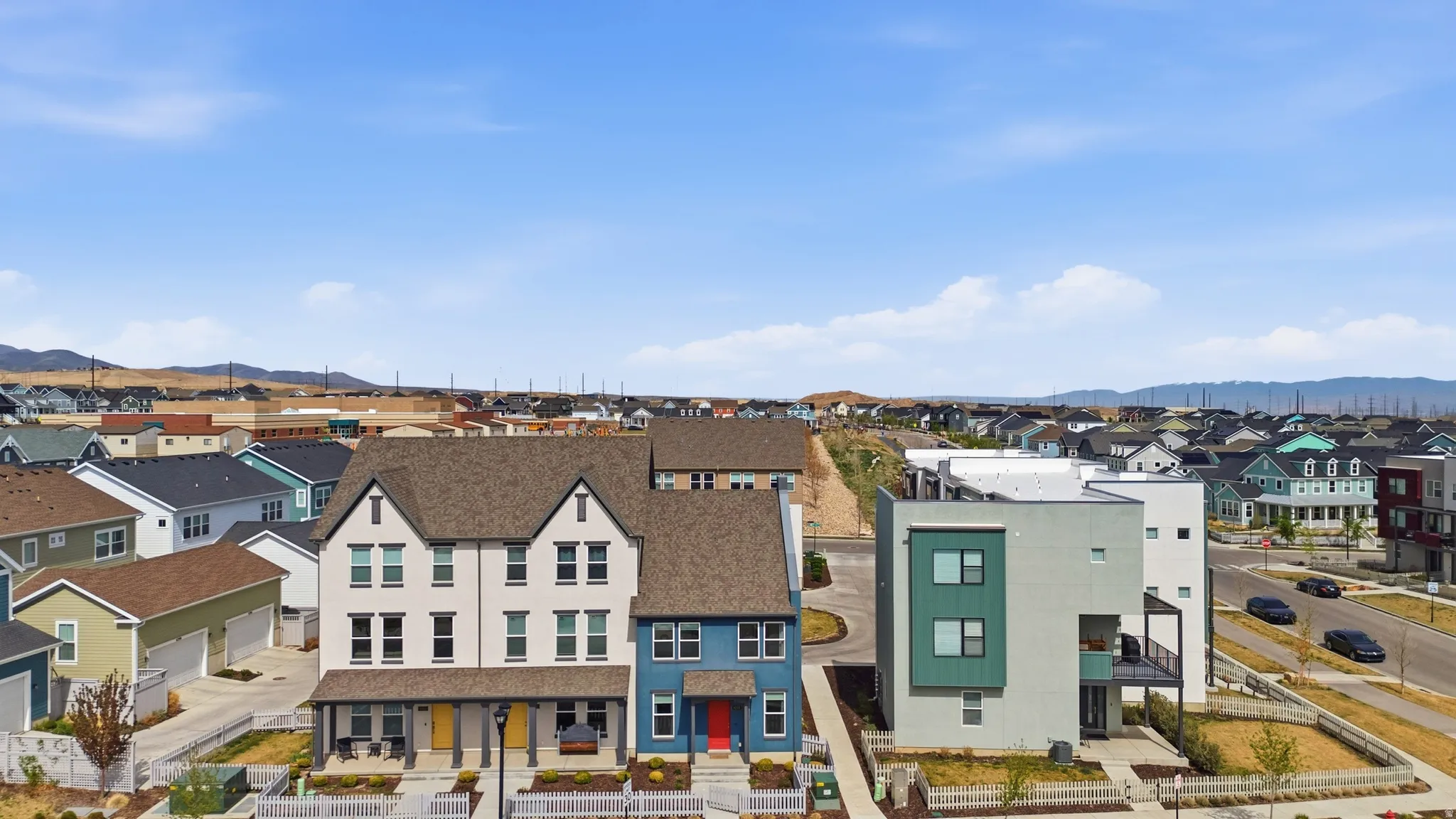 Aerial perspective of suburban area with a mountain backdrop