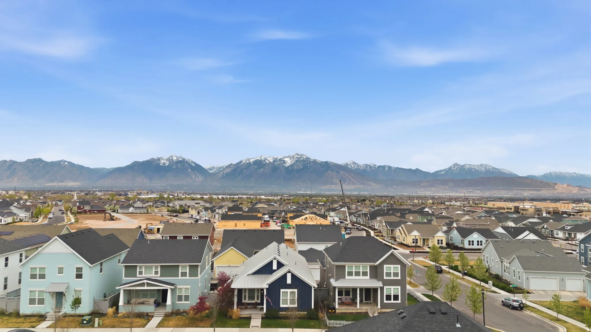 View of mountain backdrop featuring nearby suburban area