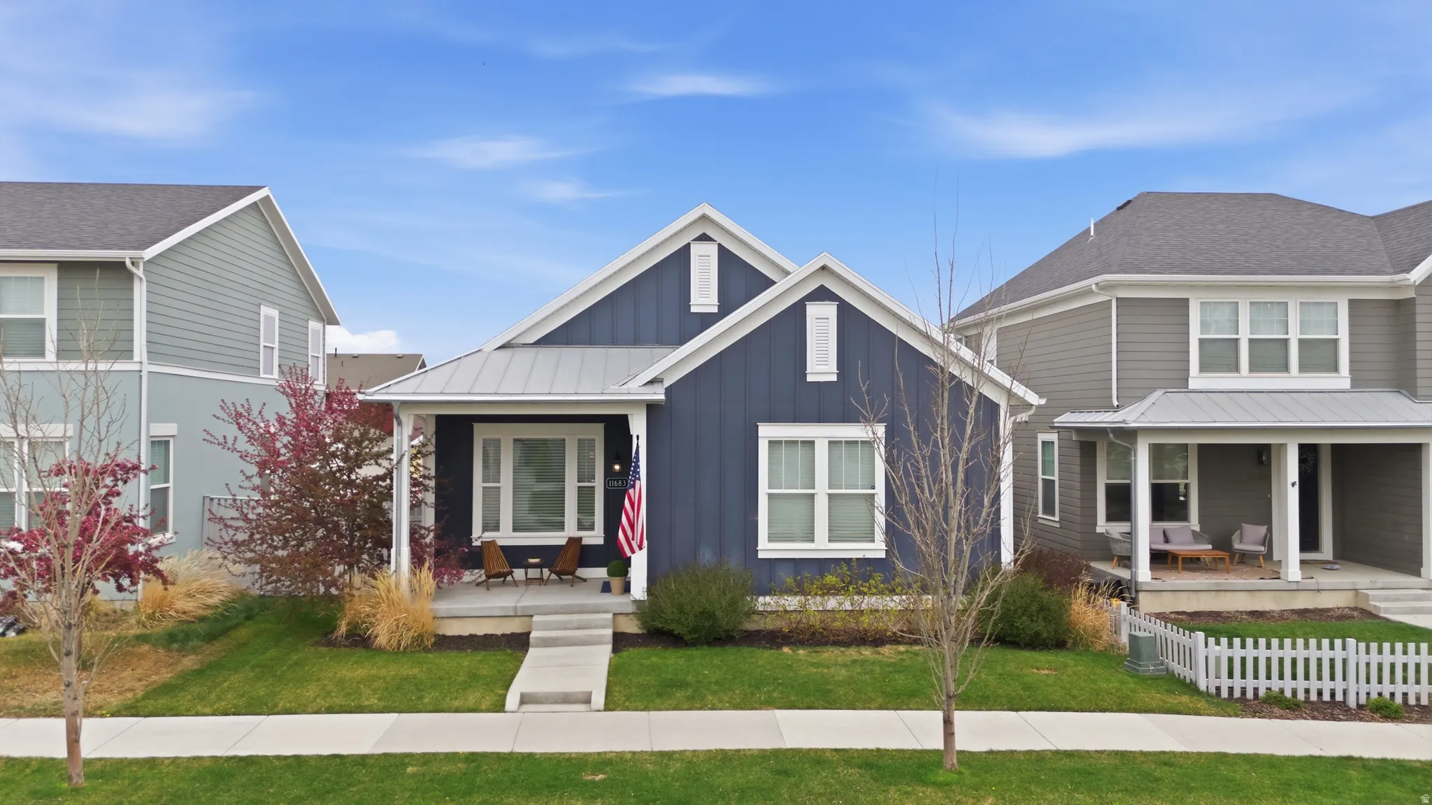 View of front of home featuring board and batten siding and covered porch