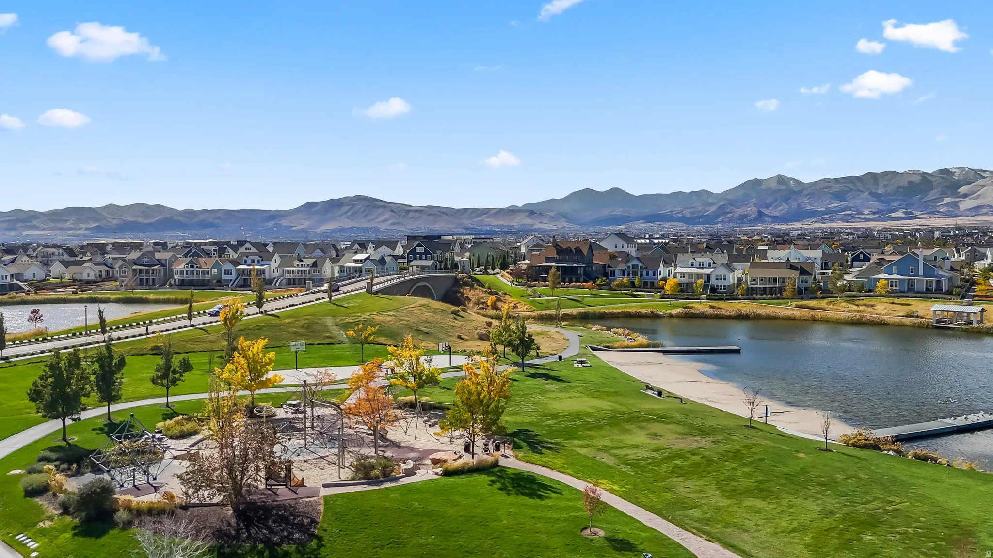 Aerial perspective of suburban area featuring a water and mountain view