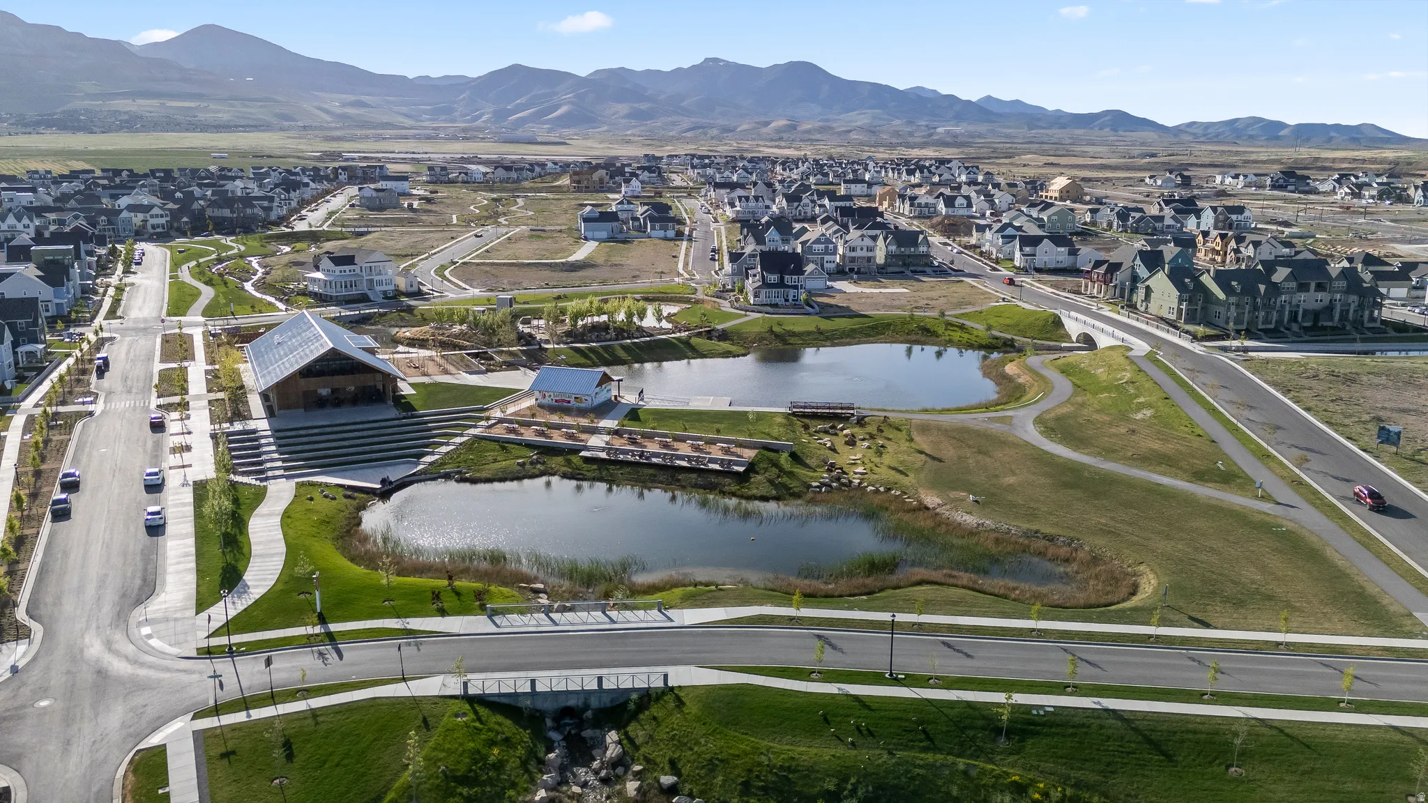 View of property location featuring nearby suburban area and a water and mountain view