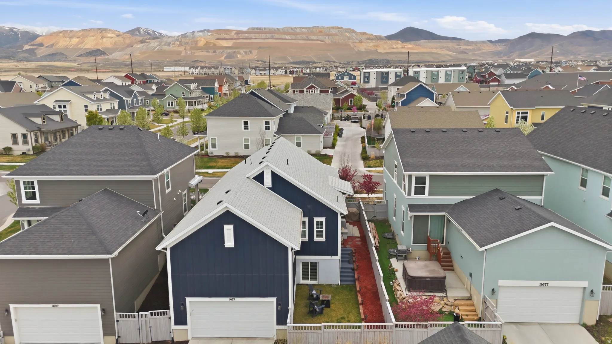 Aerial view of residential area featuring a mountainous background
