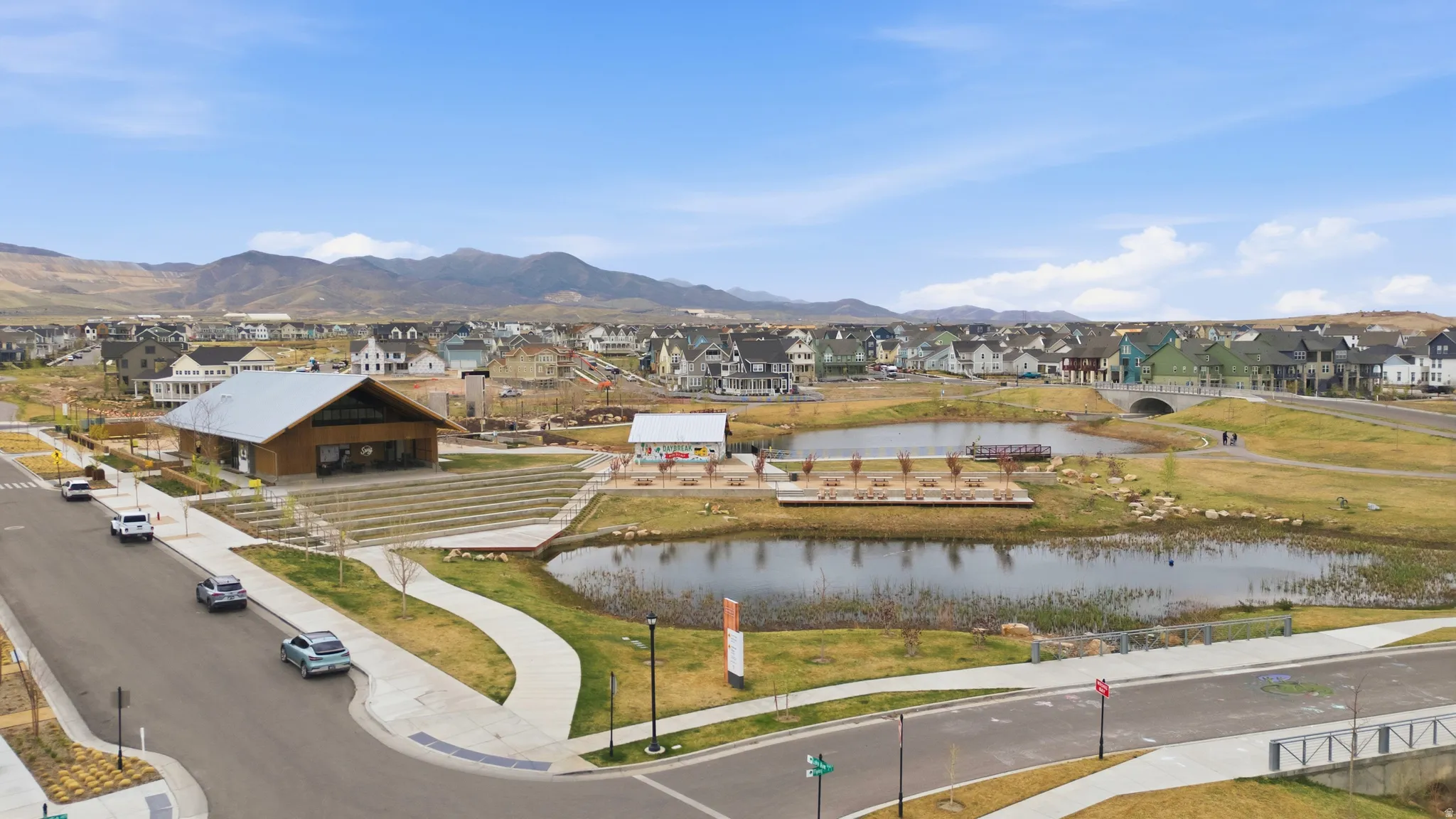 Aerial perspective of suburban area featuring a water and mountain view
