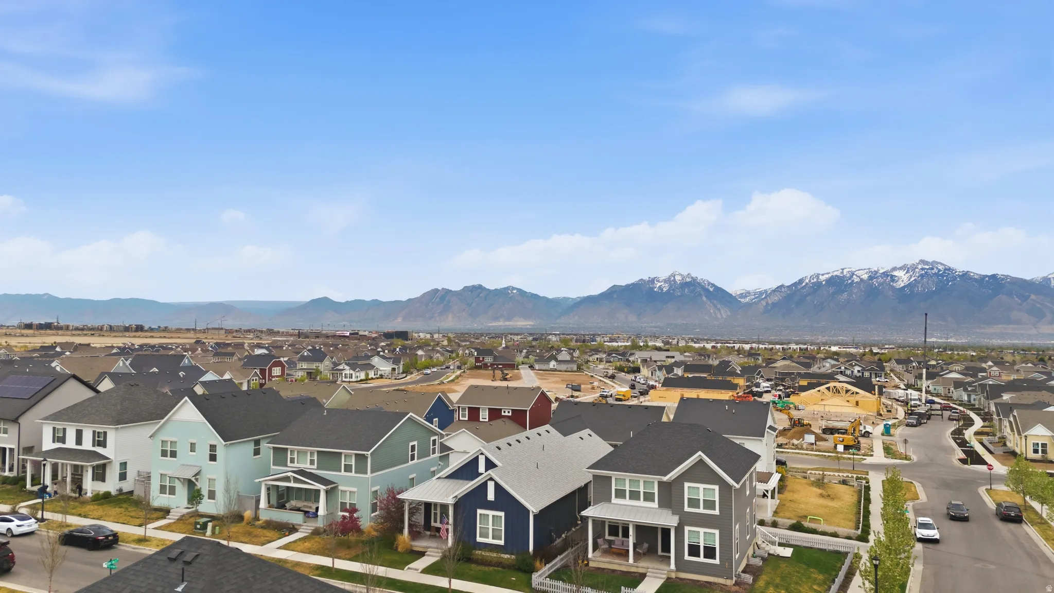 Aerial view of residential area with a mountain backdrop