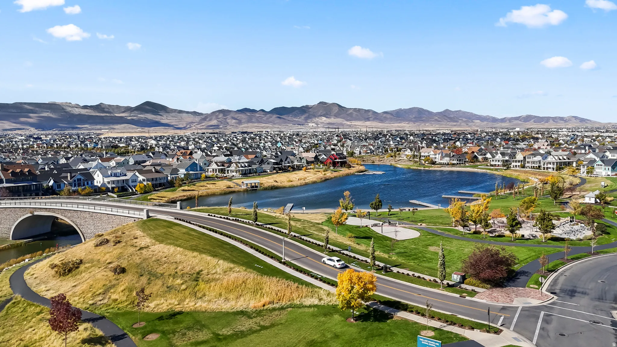 Aerial perspective of suburban area with a water and mountain view