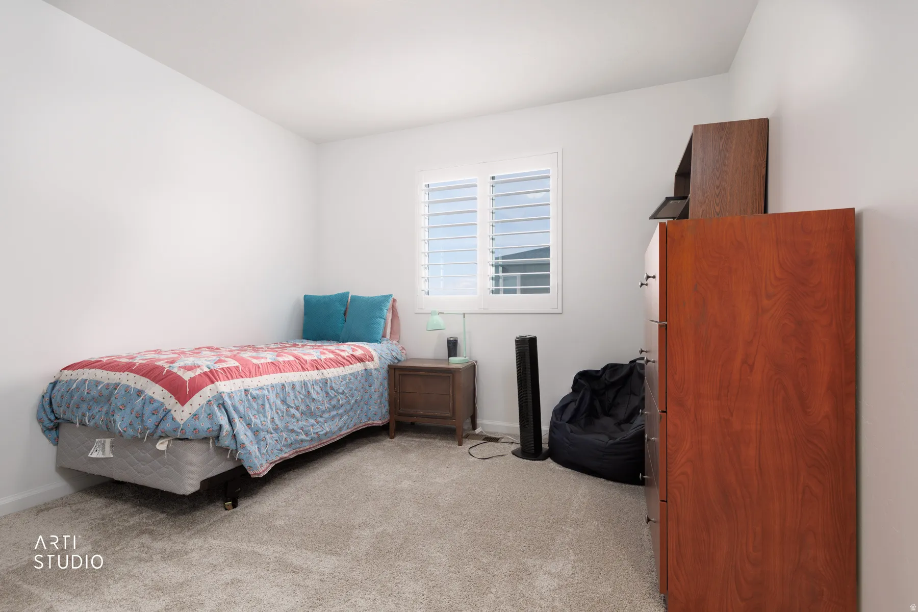 Bedroom featuring light colored carpet and baseboards