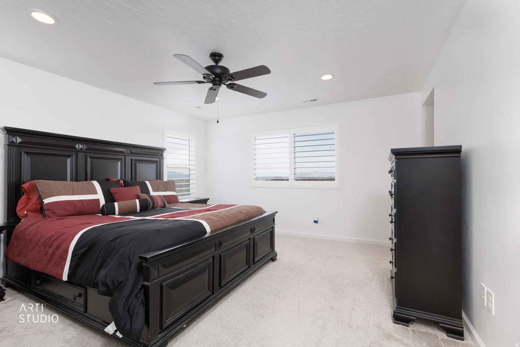 Bedroom featuring light carpet, ceiling fan, and recessed lighting