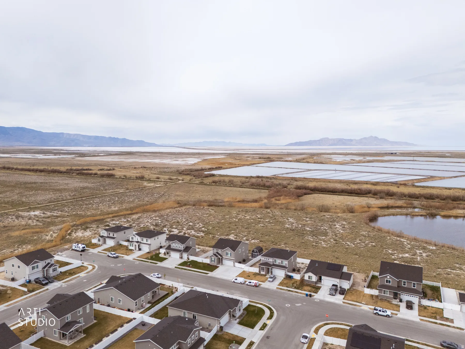 Aerial perspective of suburban area featuring a water and mountain view