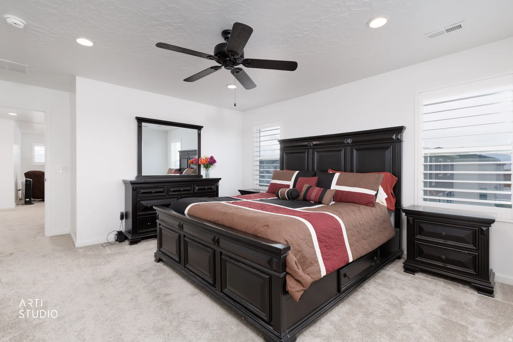 Bedroom featuring light carpet, a ceiling fan, and recessed lighting