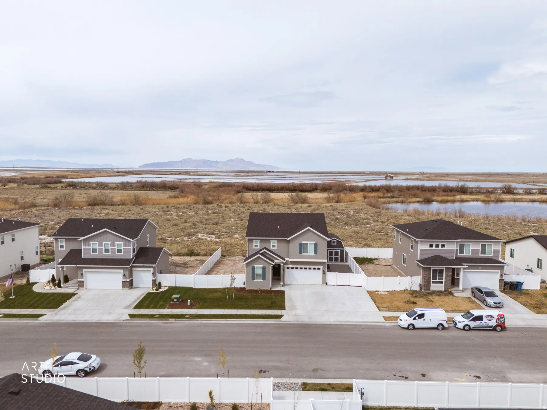Aerial view of residential area featuring a water and mountain view
