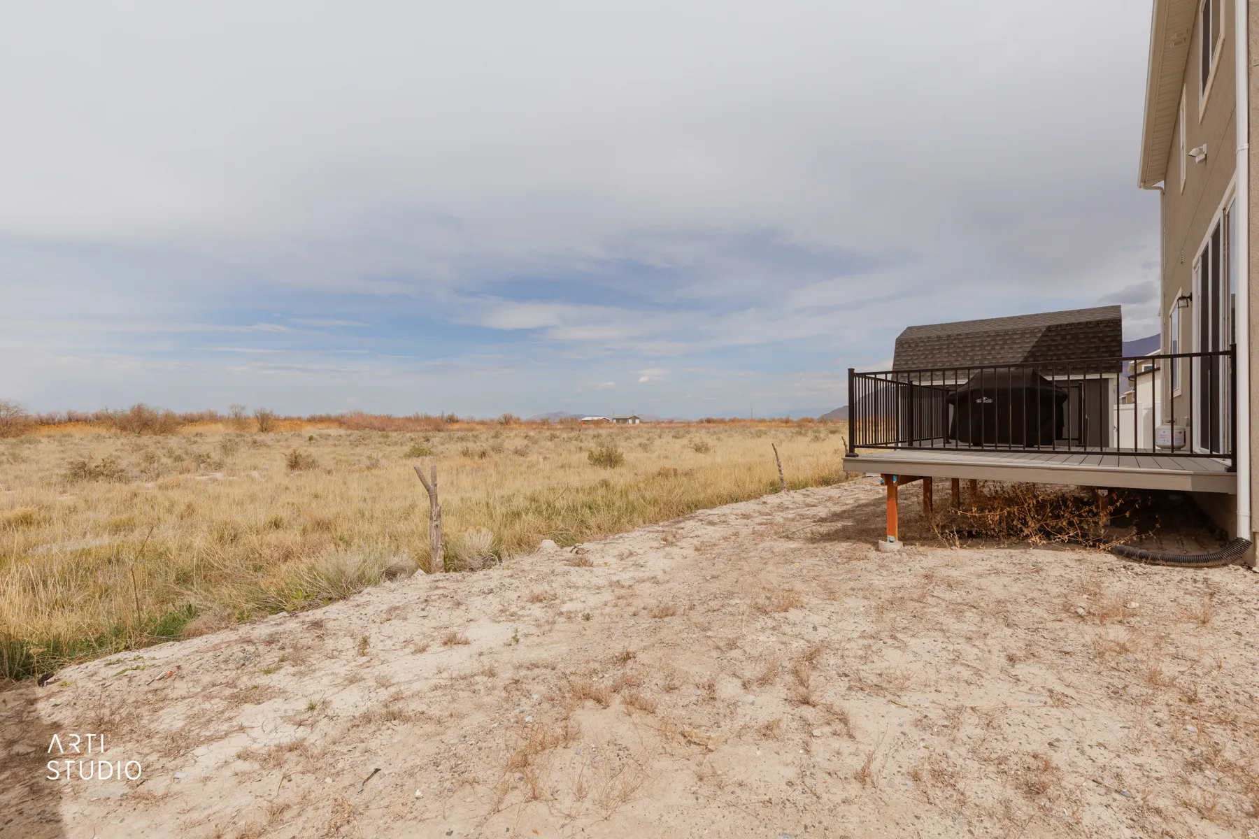 View of yard featuring a rural view and a deck