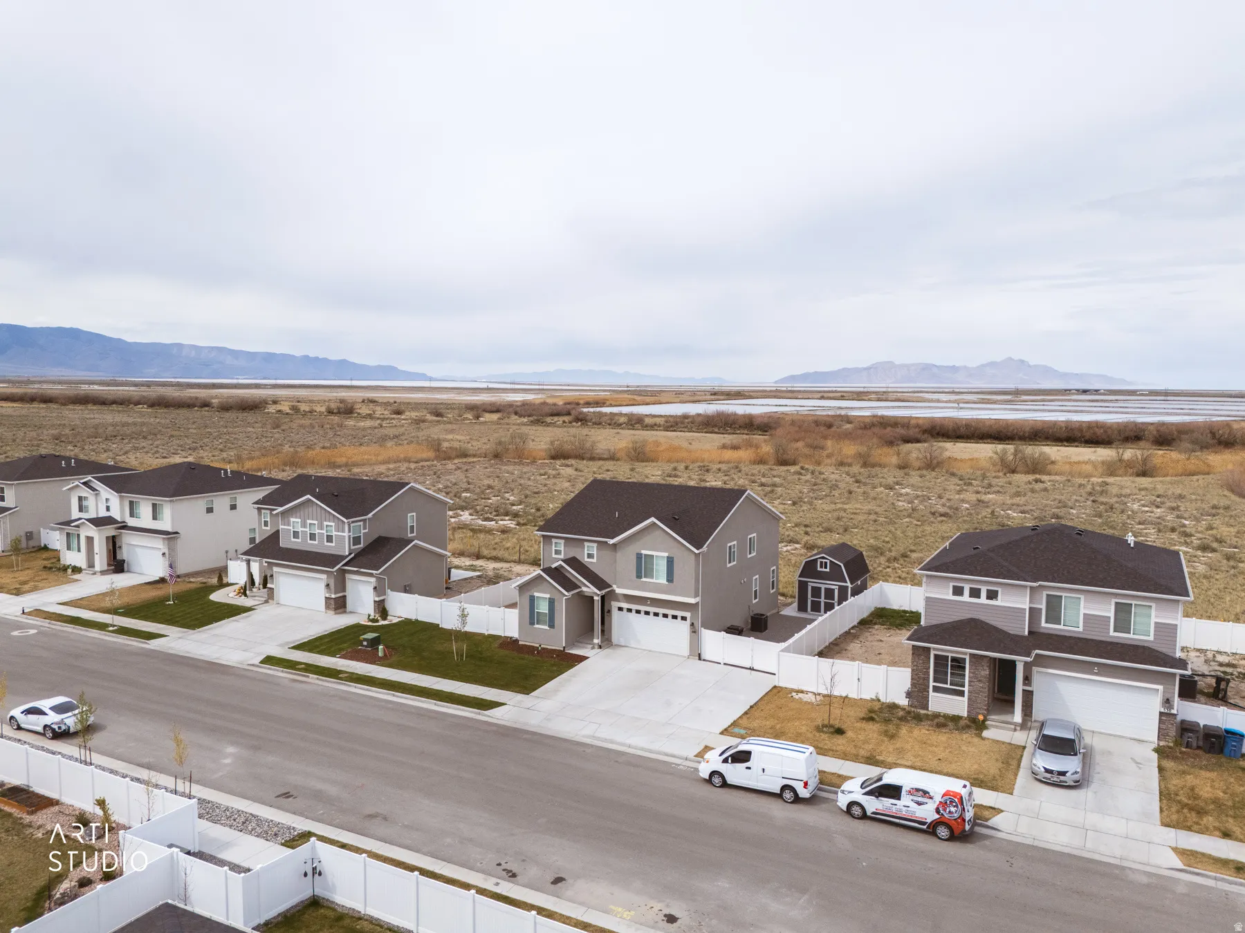 Aerial view of residential area featuring a mountainous background