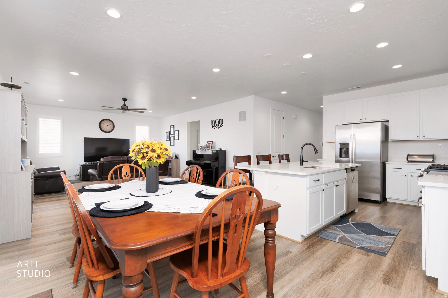 Dining space featuring light wood-style floors, recessed lighting, and a ceiling fan
