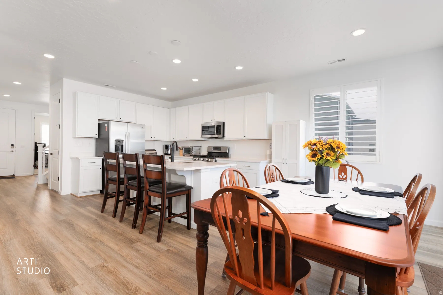 Dining space featuring light wood-style floors and recessed lighting