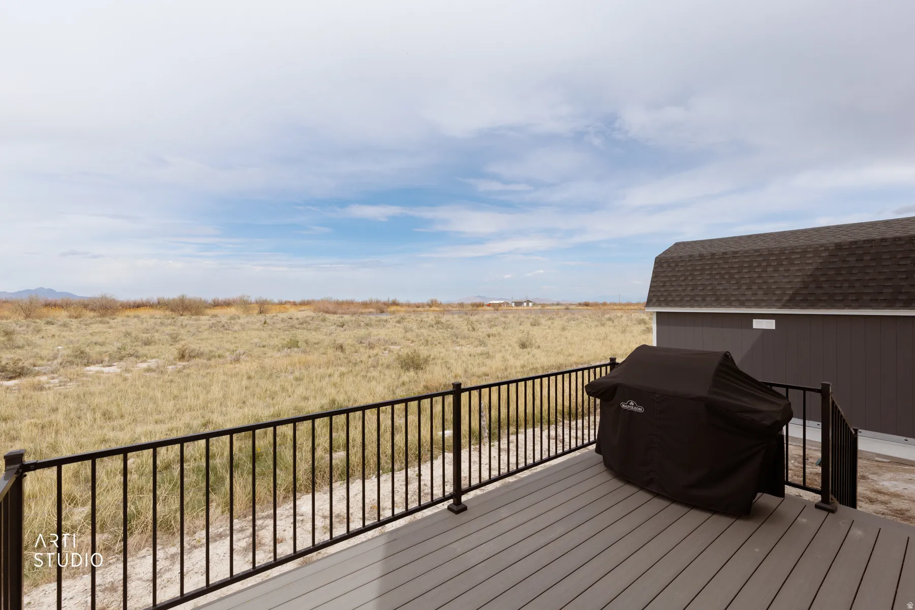 Wooden deck featuring area for grilling and a view of countryside