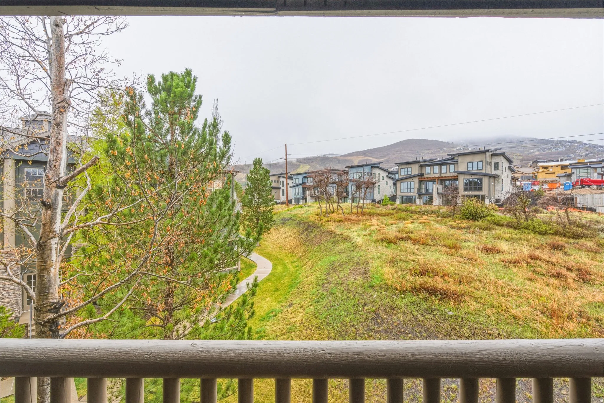View of yard with a balcony
