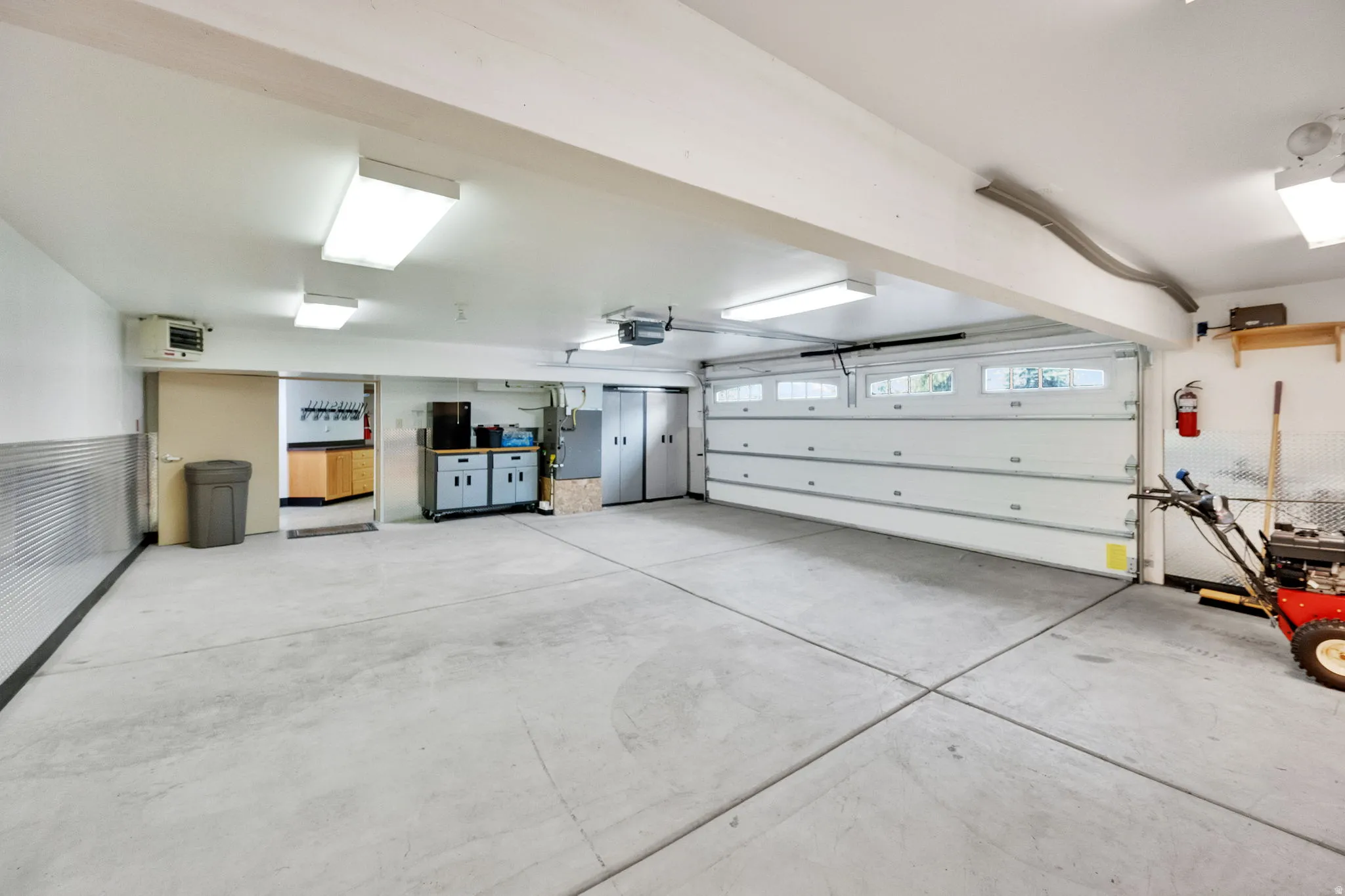 Garage featuring a heating unit