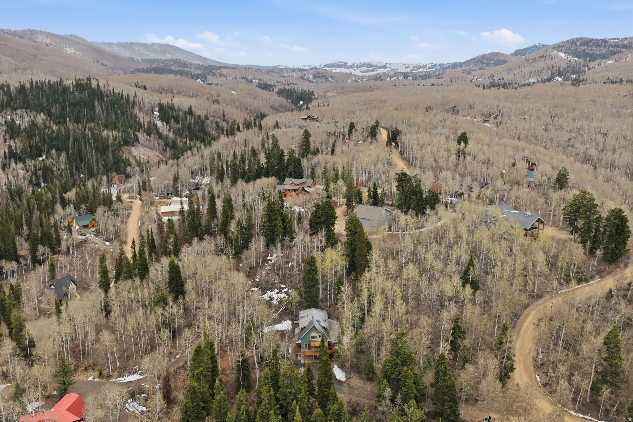 Aerial view of property's location featuring mountains