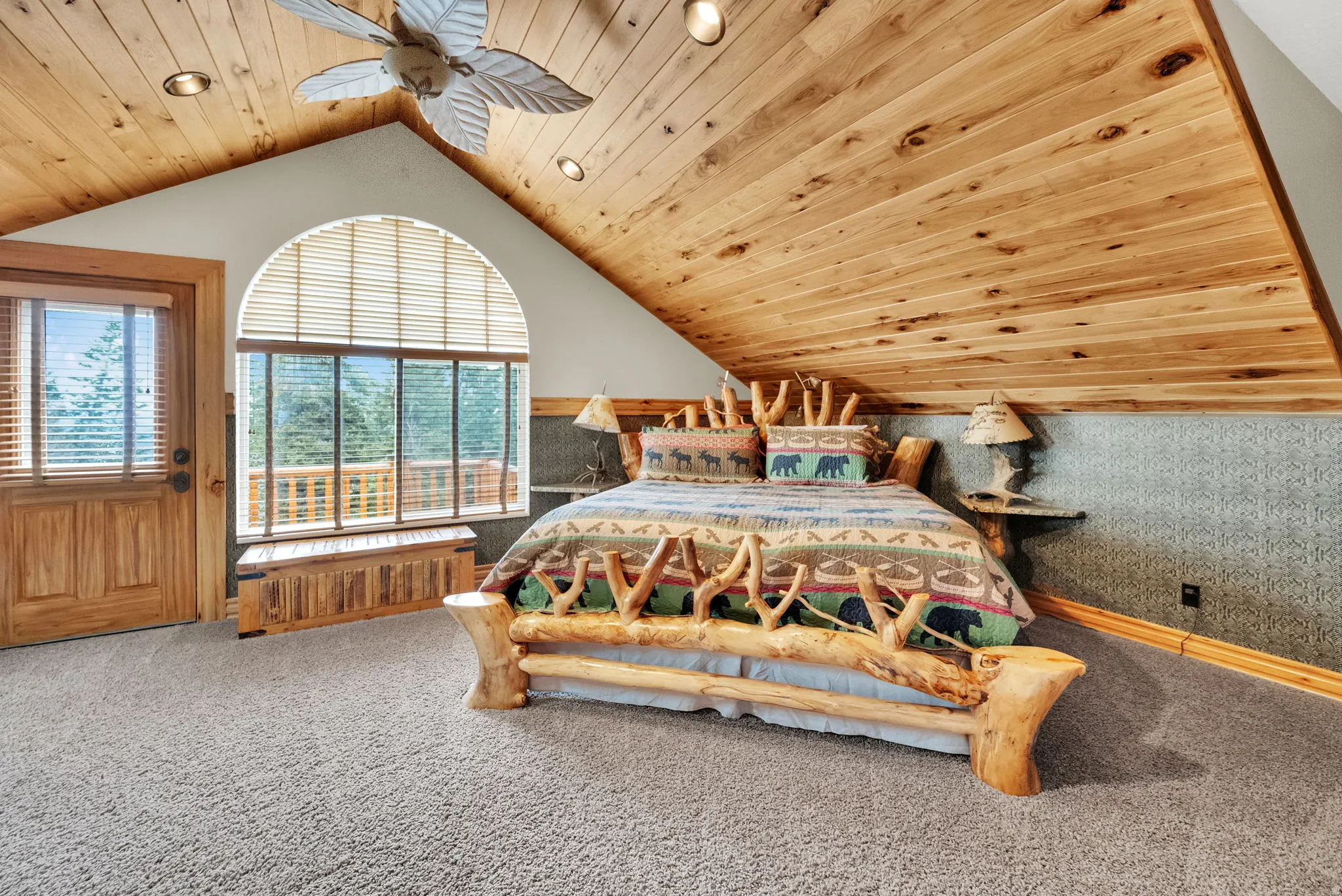Bedroom with wooden ceiling, carpet floors, a ceiling fan, and access to exterior