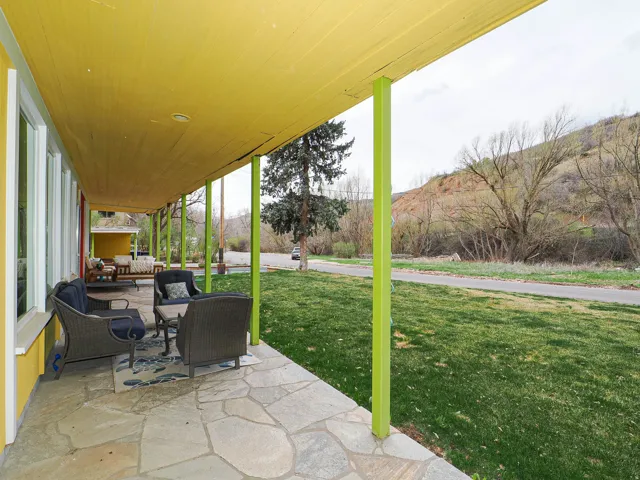View of patio with a mountain view and outdoor lounge area