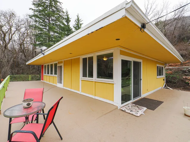 Rear view of property with outdoor dining space and a patio