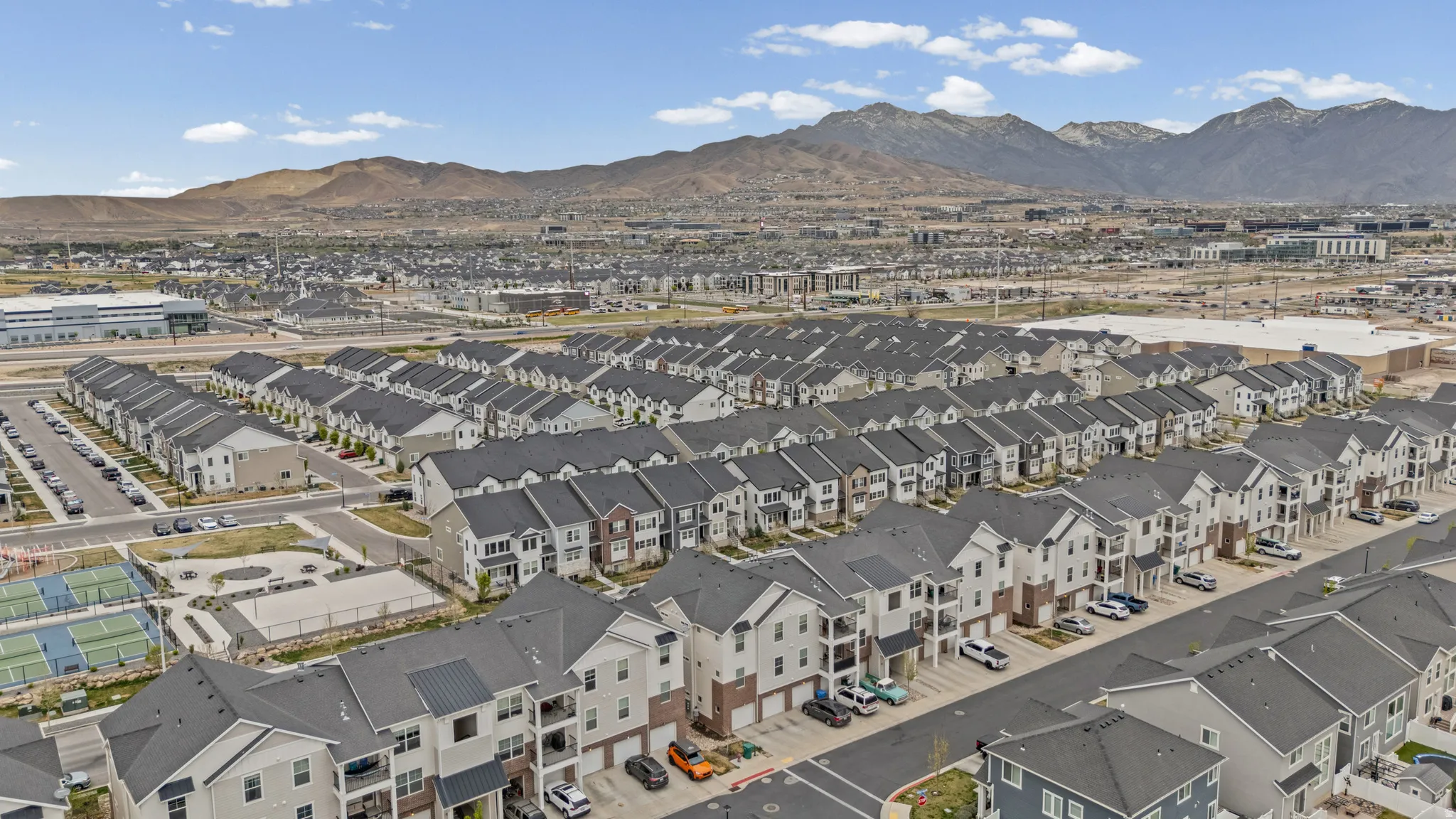 Aerial view of residential area with a mountain backdrop