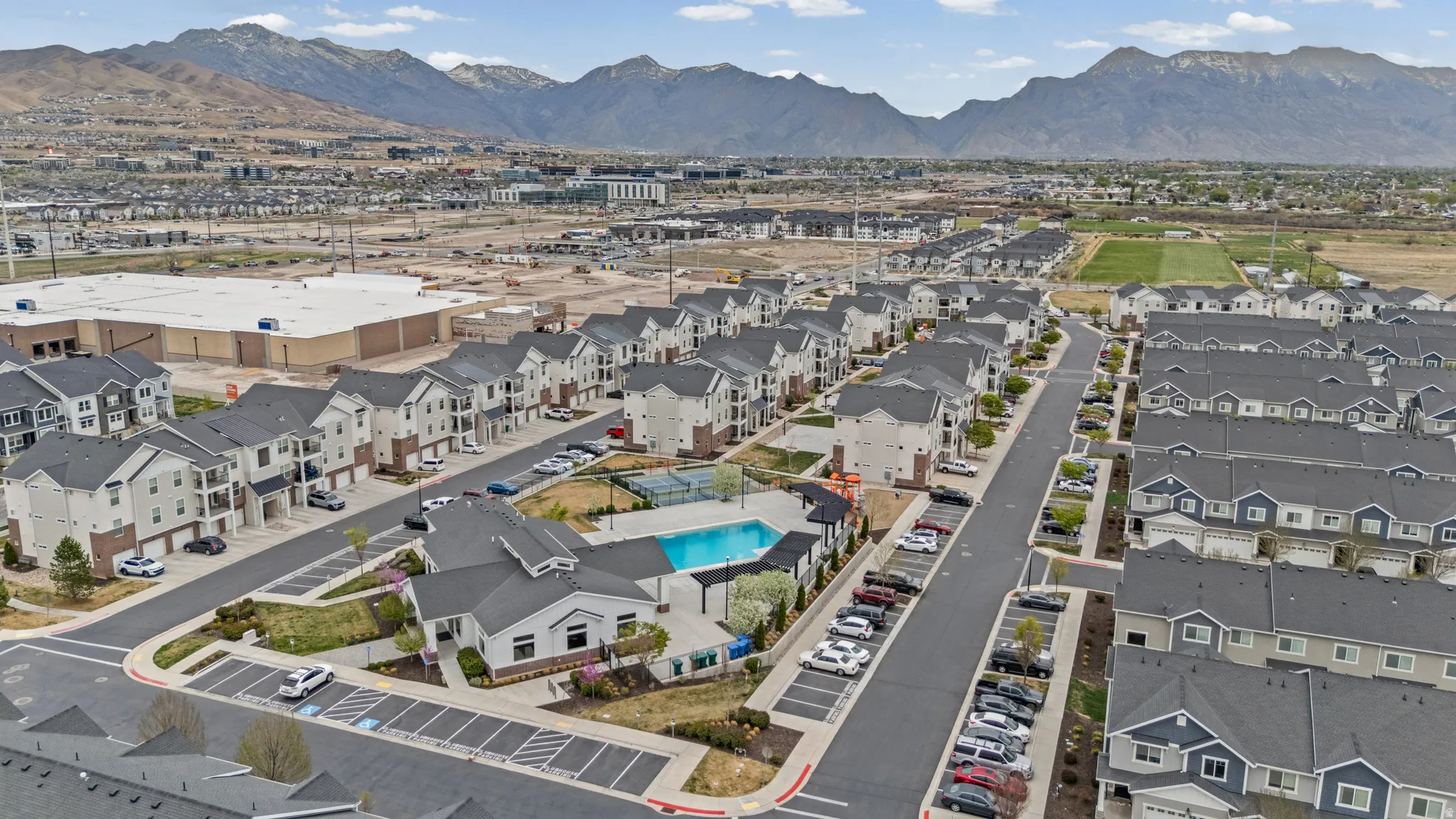 Aerial perspective of suburban area with a mountain backdrop
