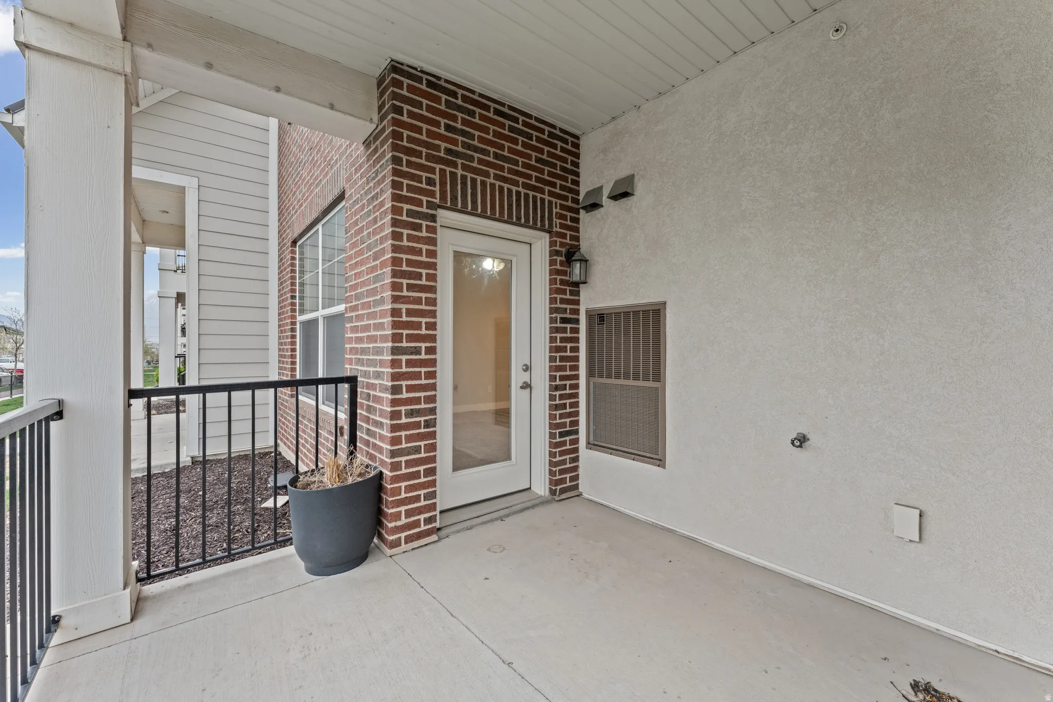 Property entrance with brick siding