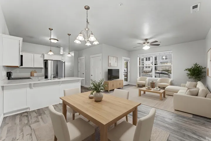 Dining area with a chandelier, a ceiling fan, and light wood-style floors