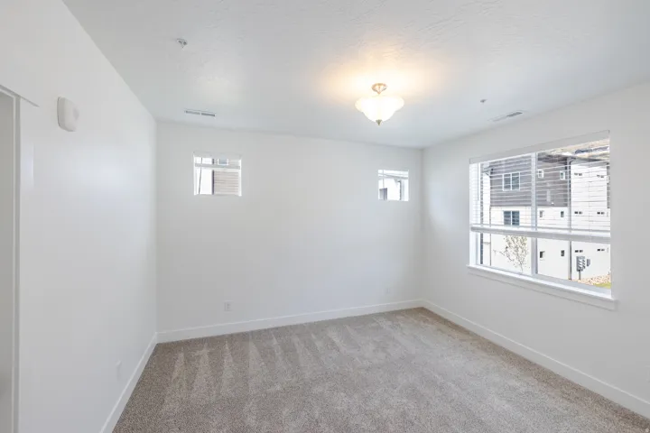 Wall-to-wall carpeting with a light neutral tone