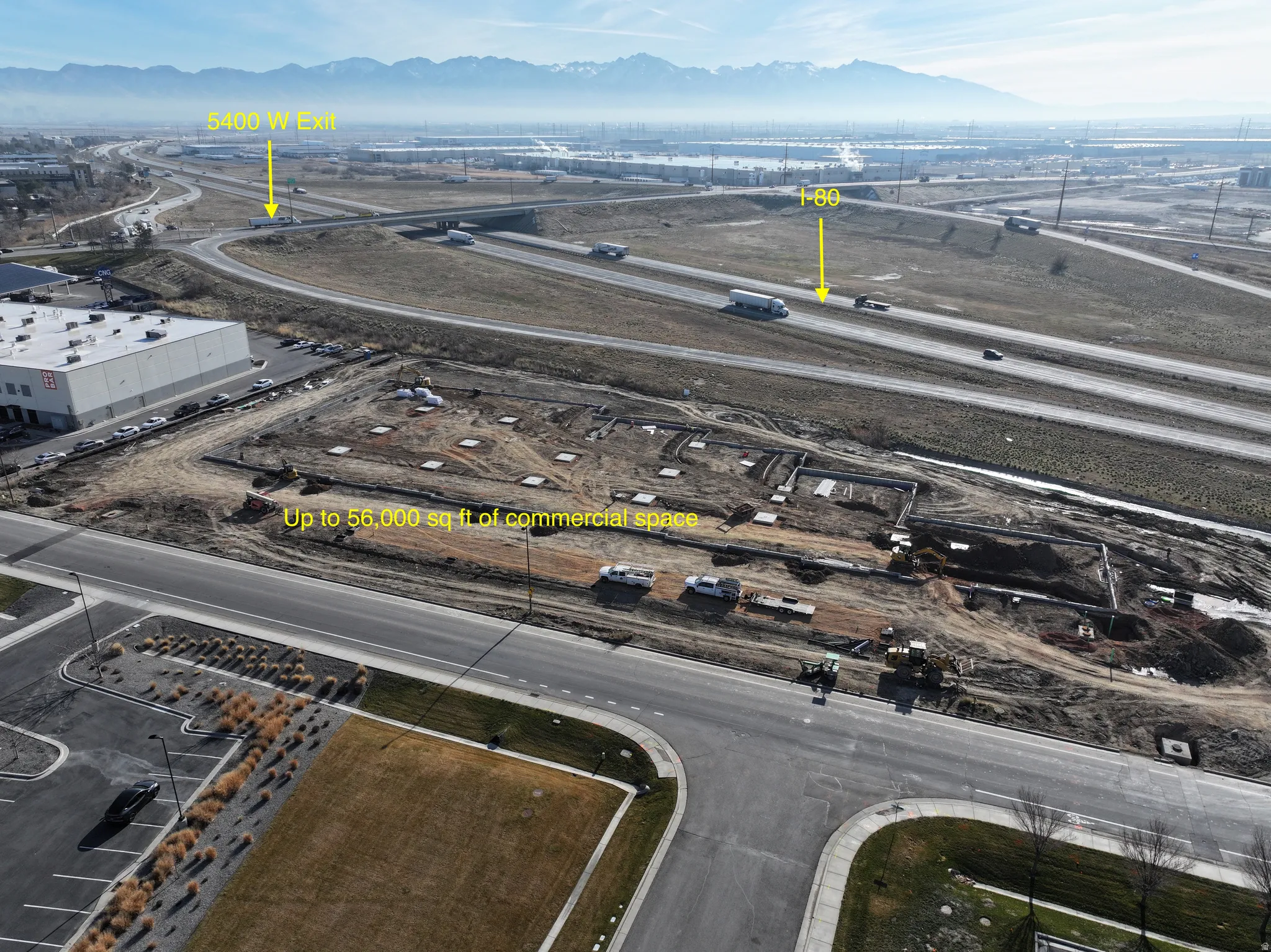 Aerial view of a mountainous background and an industrial area