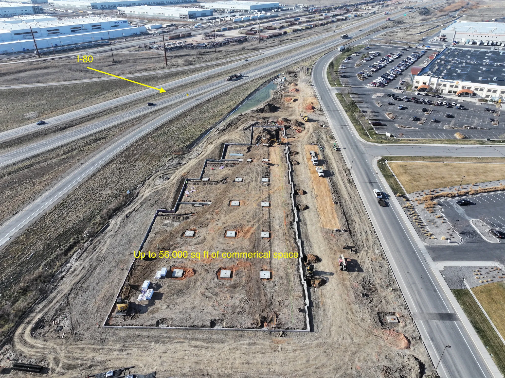 Aerial view of property's location with property parcel outlined and a main thoroughfare