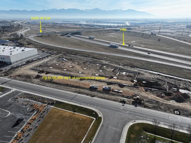 Aerial view of a mountainous background and an industrial area