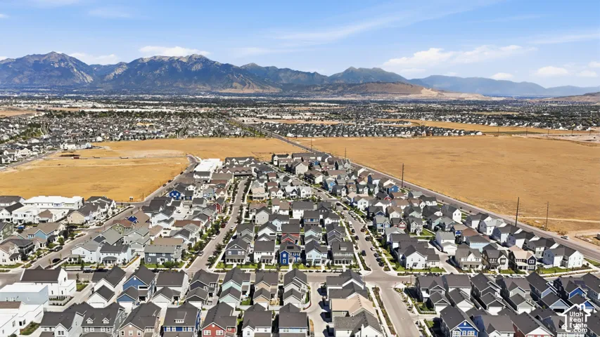 Expansive residential development featuring a variety of single-family homes with mountain backdrops