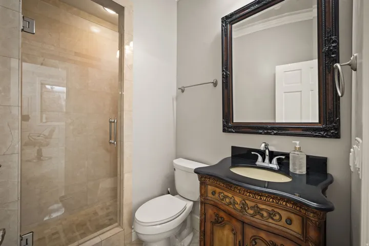 Full bathroom featuring vanity and a stall shower
