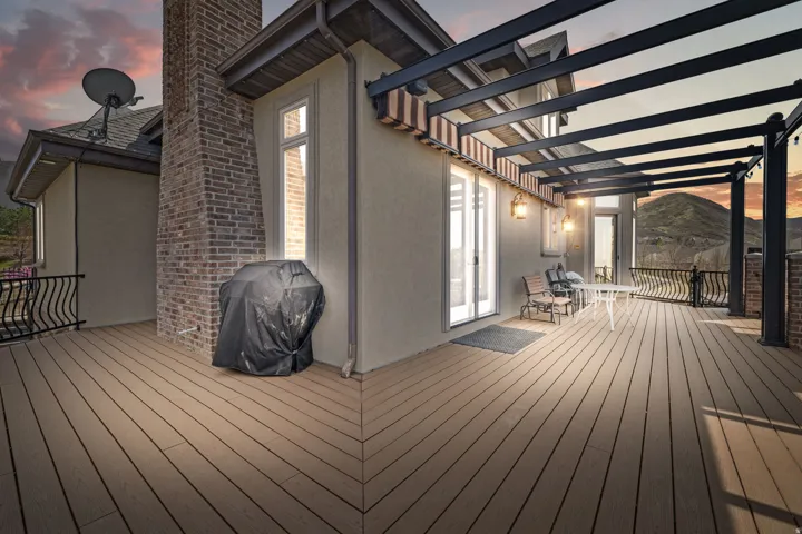 Deck at dusk with a grill and a mountain view