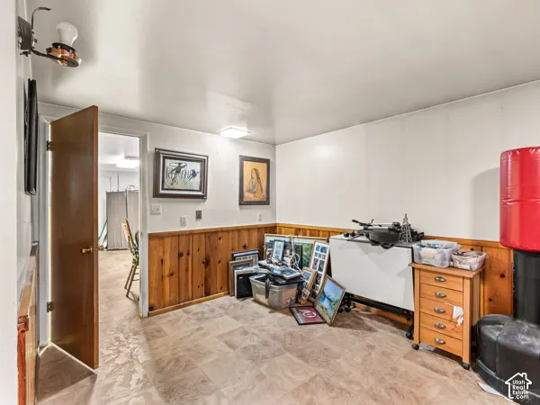 Interior space with a wainscoted wall and wooden walls