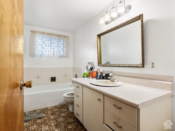 Bathroom featuring vanity and a garden tub