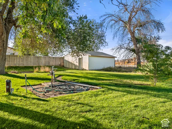 View of yard with an outdoor structure