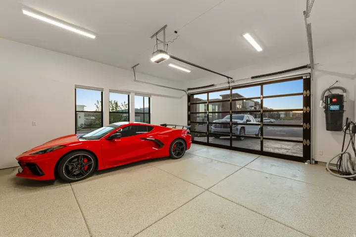 Garage with a central vacuum unit and a garage door opener