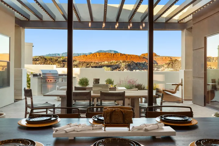 View of patio with an outdoor kitchen / dining area, a mountain view, a fire pit, and a pergola