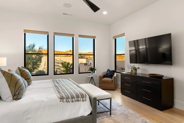 Bedroom featuring light wood finished floors, ceiling fan, and recessed lighting