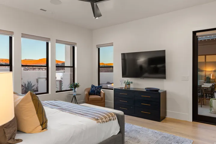 Bedroom with light wood-style floors and ceiling fan