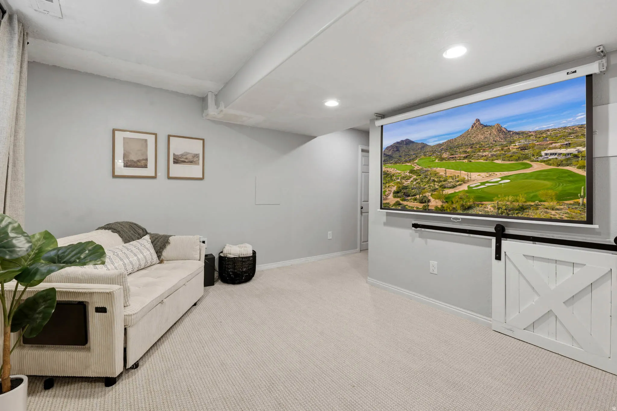 Sitting room featuring light carpet and recessed lighting