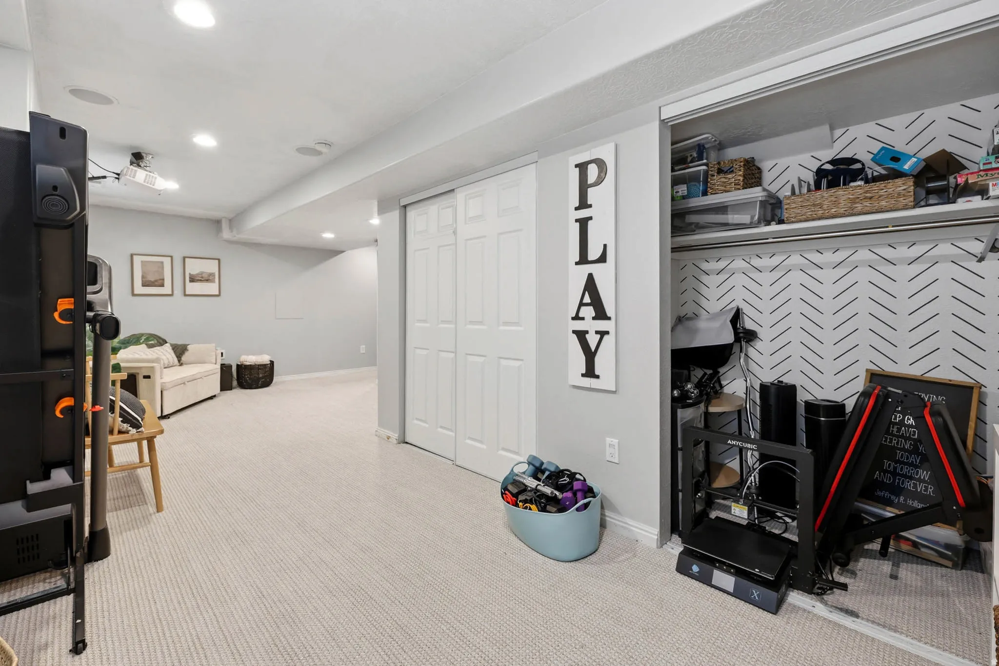 Interior space featuring light colored carpet and recessed lighting