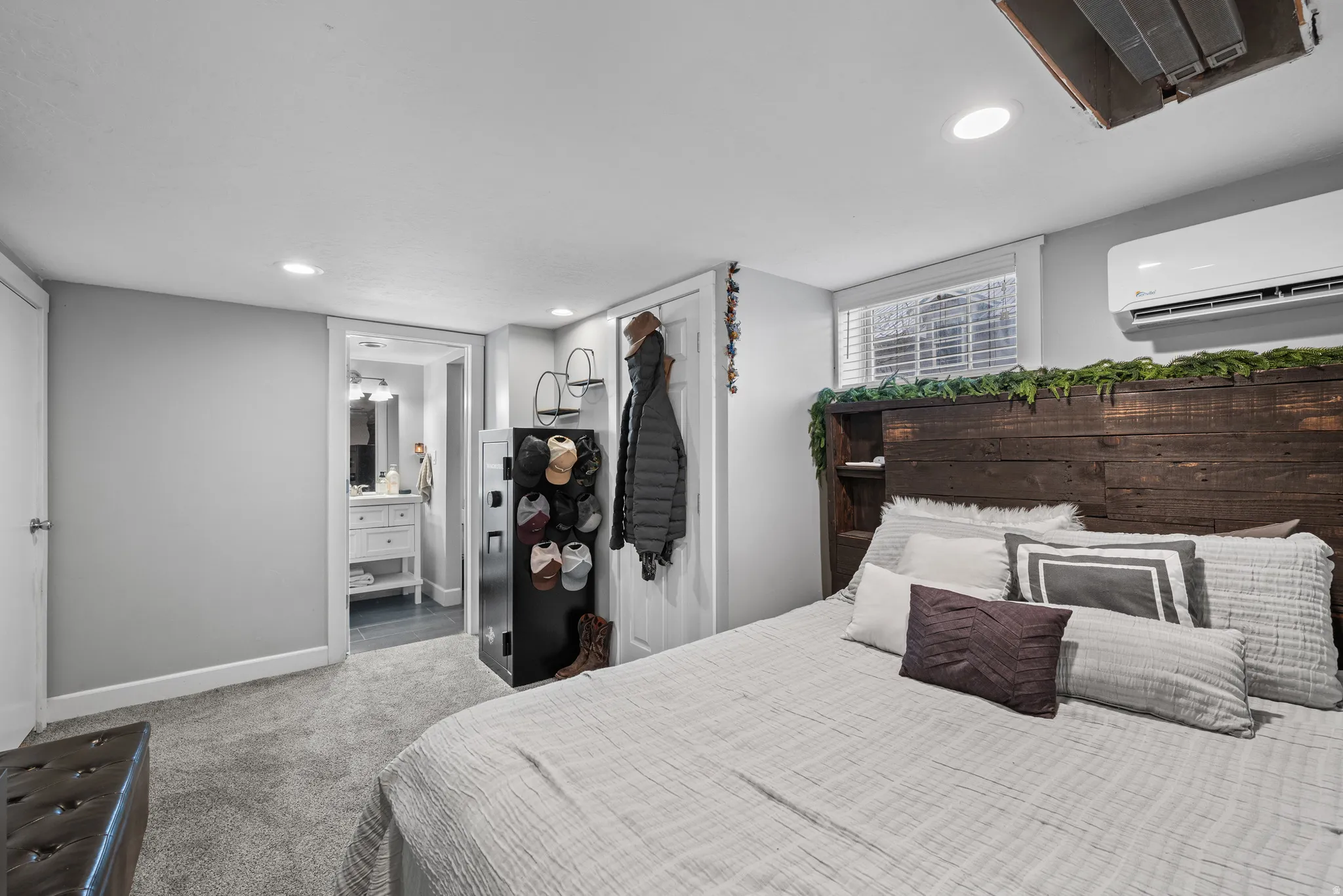 Bedroom with carpet, recessed lighting, and ensuite bath