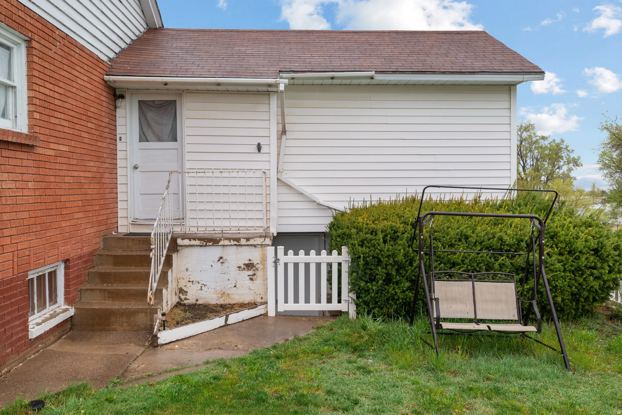 View of property exterior featuring roof with shingles