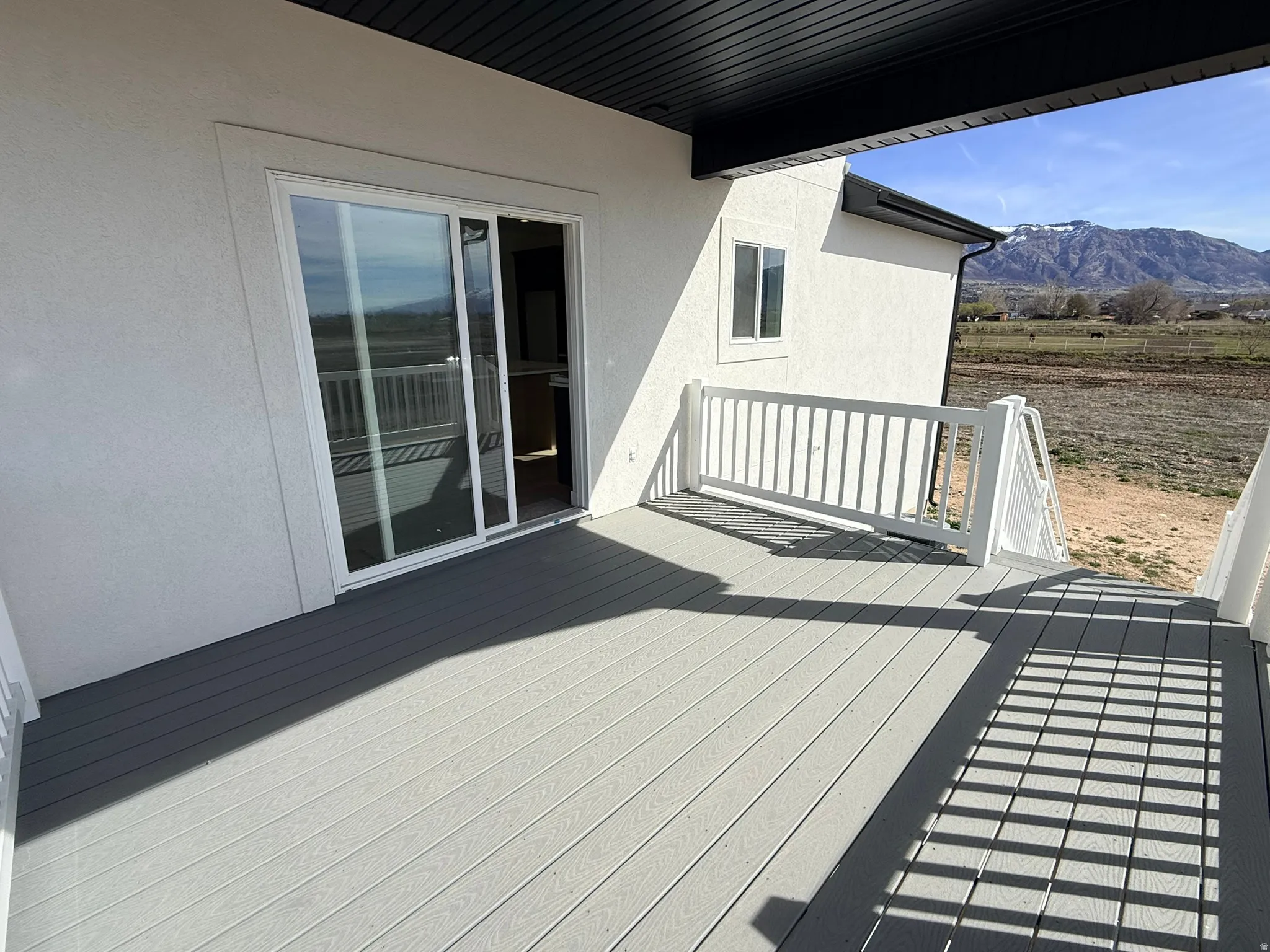 Wooden deck featuring a mountain view